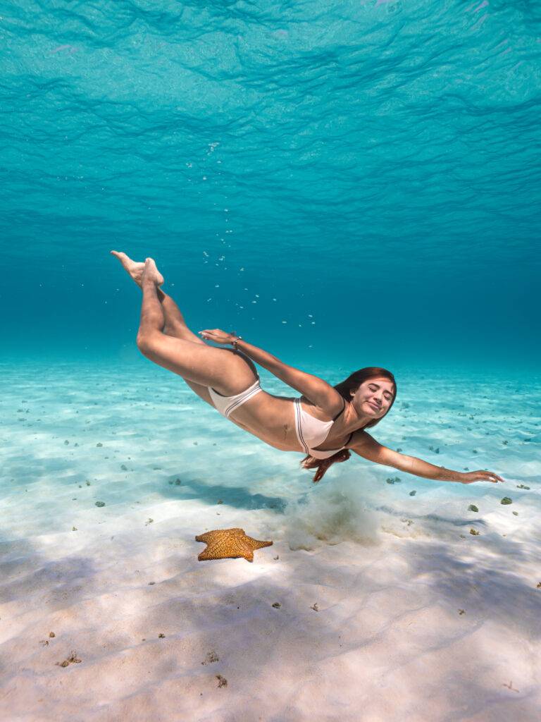 underwater photographer capturing portraits in coral reef Cozumel